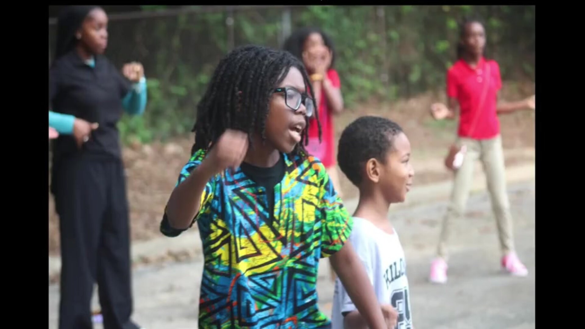 Kilombo students and educators spending time together outdoors
